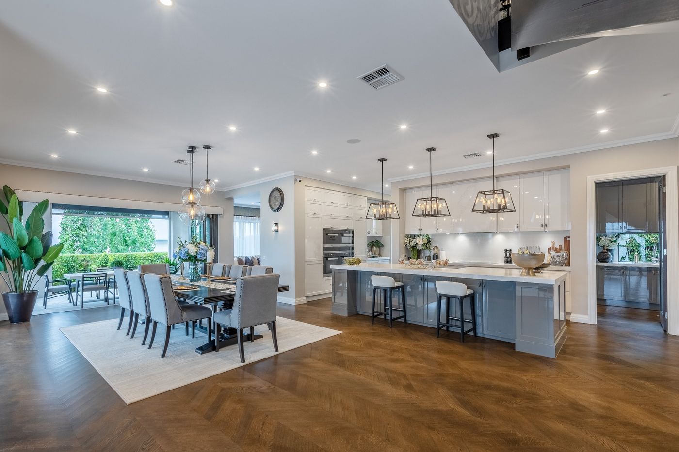 Kitchen with a long island bench and pendant lights